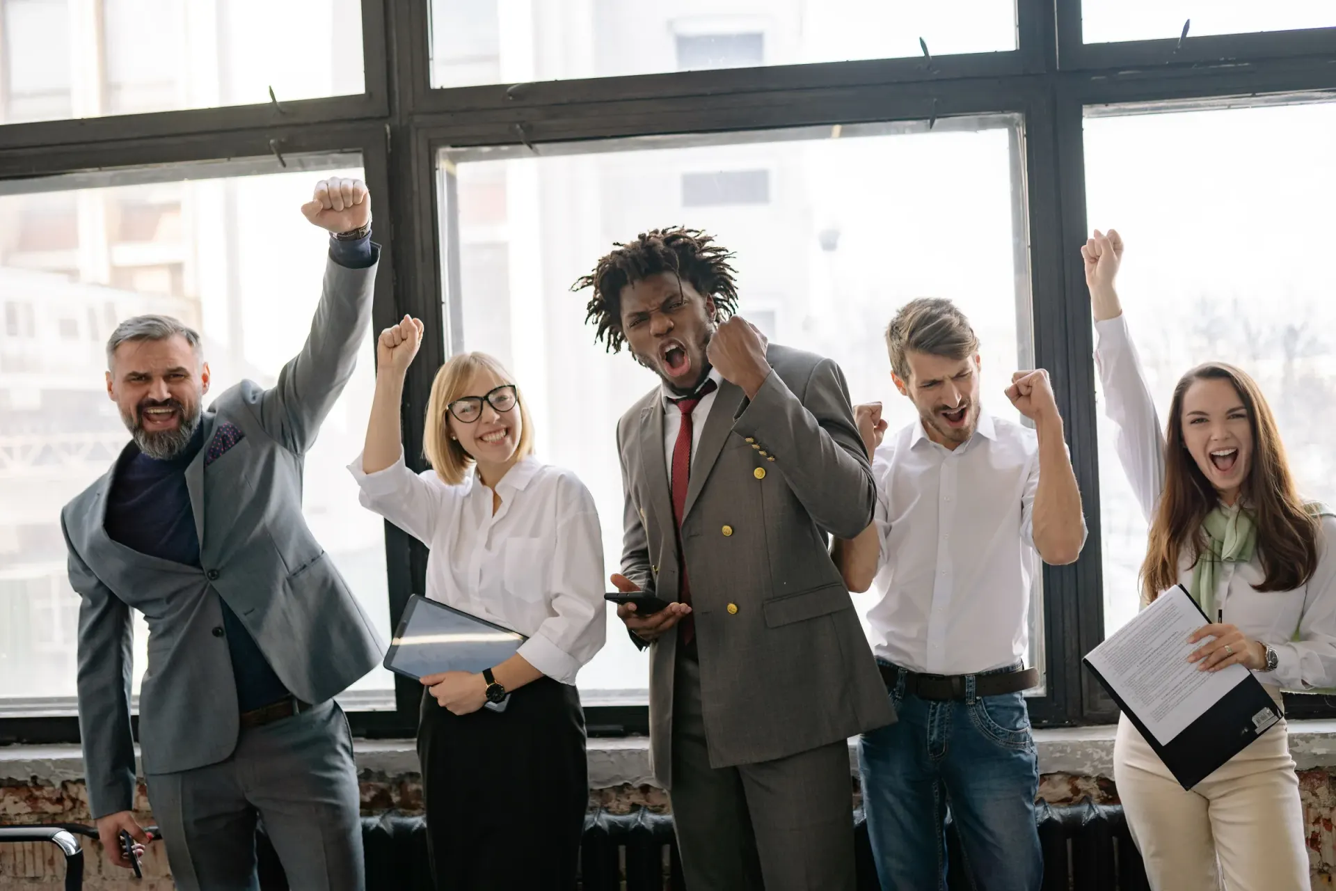 MASExam corporate exam prep success team celebrating in a modern office